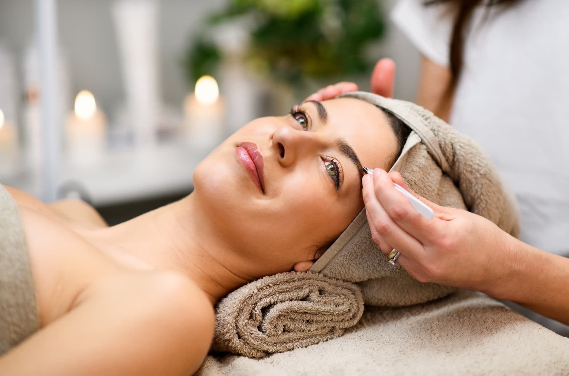 Client receiving a professional brow shaping treatment at Studio Di Maria